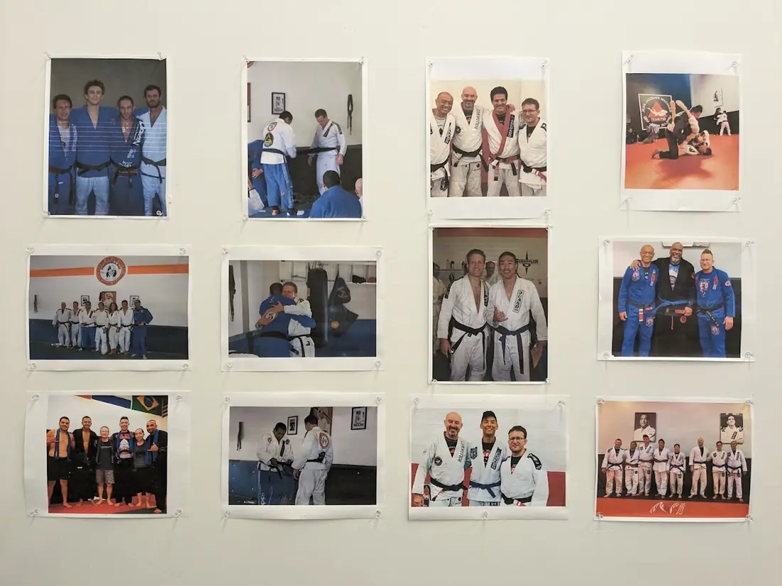 A wall of photos from Gene Folgo's years of Brazilian Jiu-Jitsu training